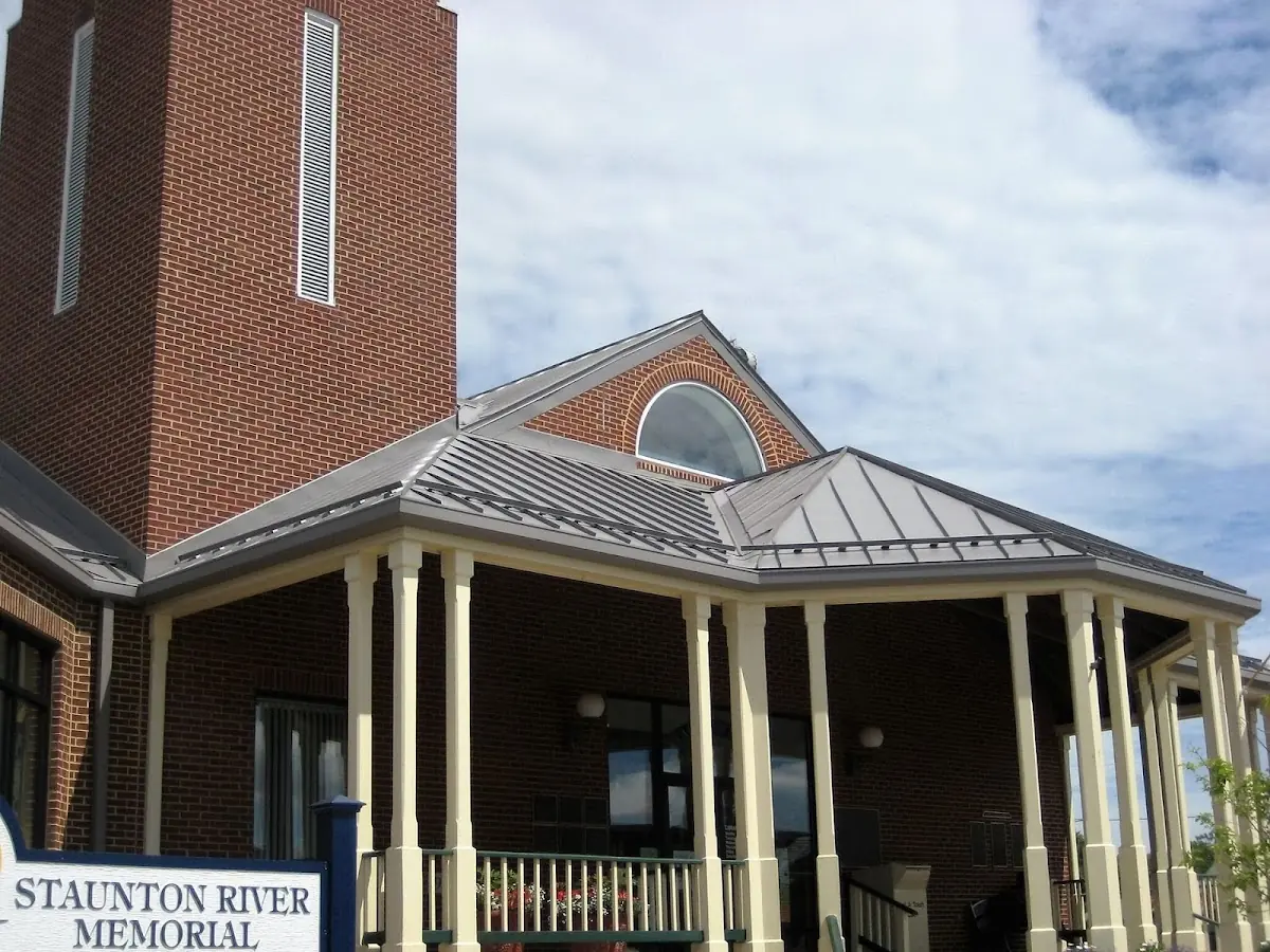 Skilled roofing craftsmen working on a residential roof in Northeast Warren